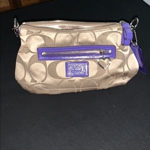 Small COACH purse. Tan/brown with purple details.